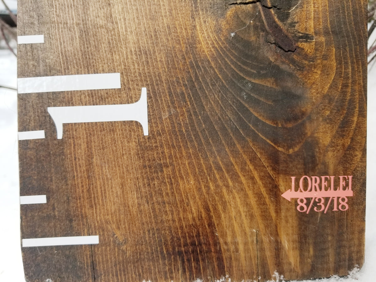 A piece of wood with a Simple Name and Birthdate Arrow ruler on it by Little Prairie Craft Co.