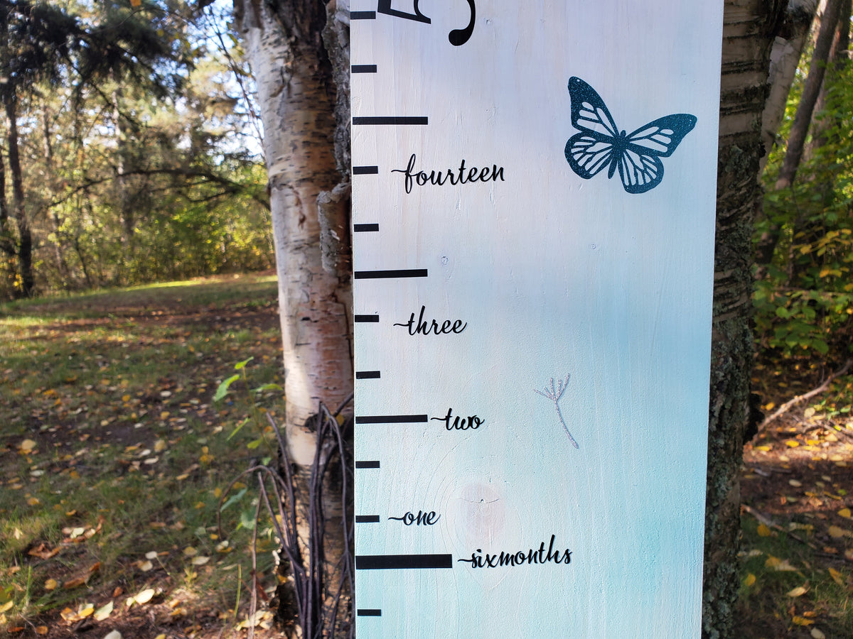 A Written Words Height Marking Arrows growth chart with a butterfly on it from Little Prairie Craft Co.