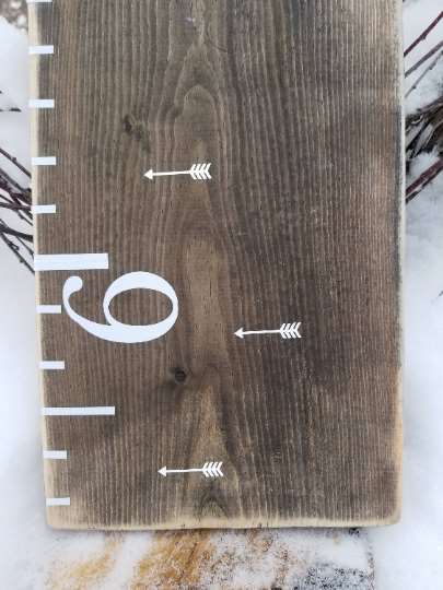 A Little Prairie Craft Co. wooden growth chart with Classic Blank Height Marking Arrows on it.