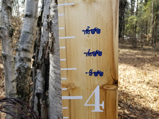 A Monster Truck Height Marking Arrows on a tree in the woods by Little Prairie Craft Co.