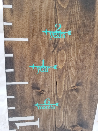 A Fancy Height Marking Arrows growth chart with numbers on it by Little Prairie Craft Co.