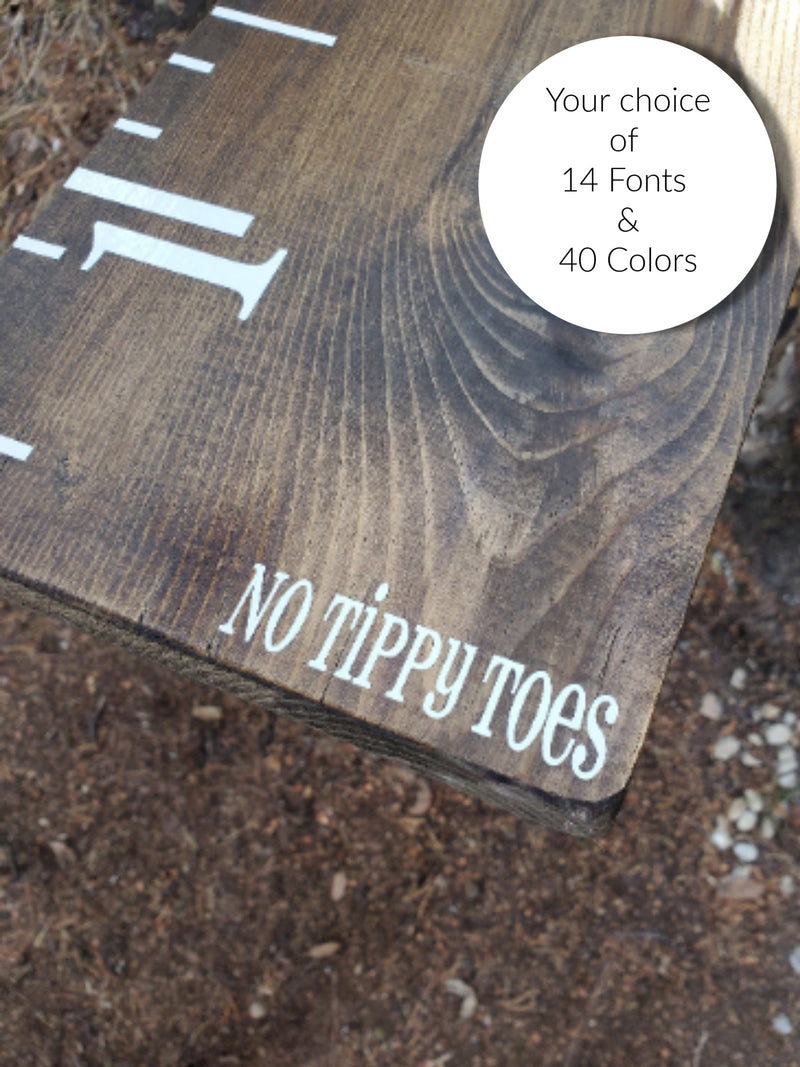A wooden No Tippy Toes ~Growth Chart Sticker with the words no tippy toes by Little Prairie Craft Co.
