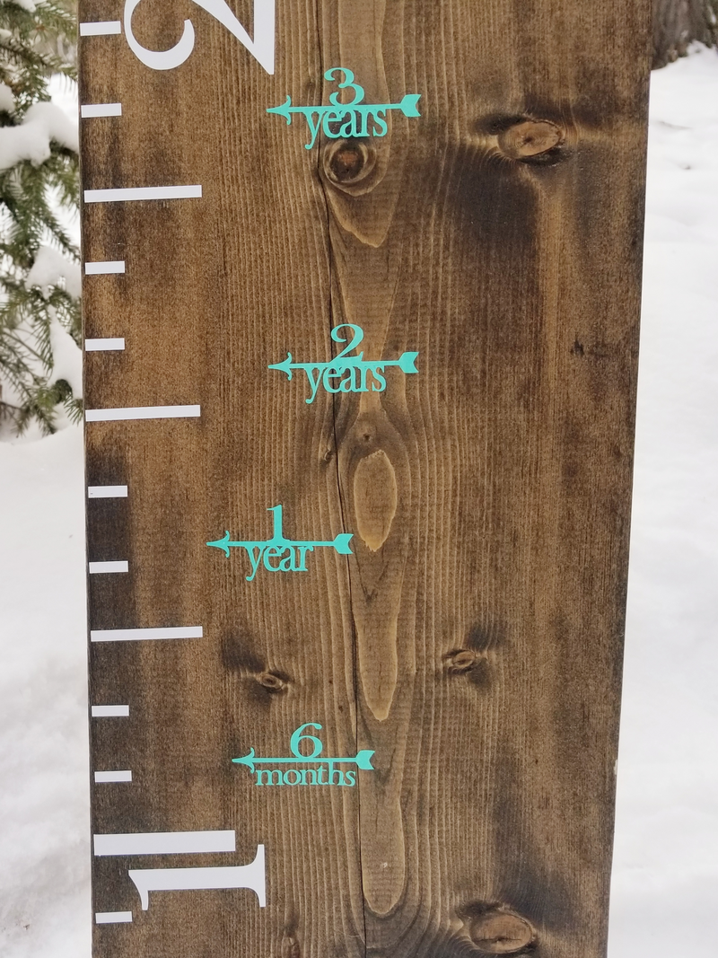 A Fancy Height Marking Arrows growth chart in the snow by Little Prairie Craft Co.