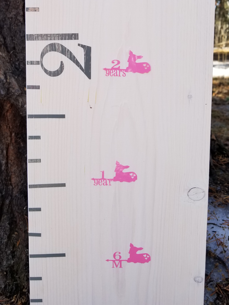A Fawn Height Marking Arrows growth chart with pink elephants on it, made by Little Prairie Craft Co.