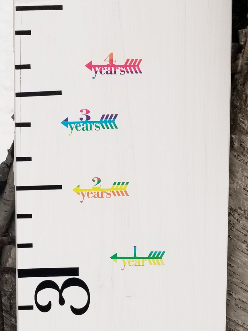 Traditional Height Marking Arrows by Little Prairie Craft Co. on a wooden growth chart.