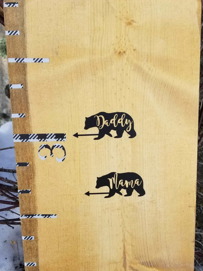 A wooden growth chart with Bear Parent Height Markers and arrows on it, by Little Prairie Craft Co.