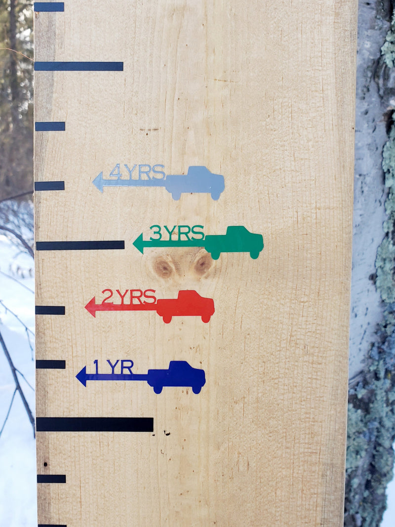 A Truck Height Marking Arrows growth chart in the snow by Little Prairie Craft Co.
