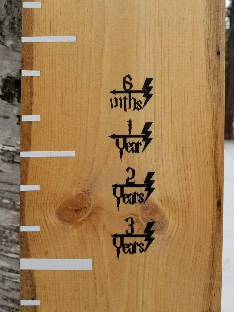 A Little Prairie Craft Co. wooden growth chart with Lighting Bolt Height Marking Arrows on it.