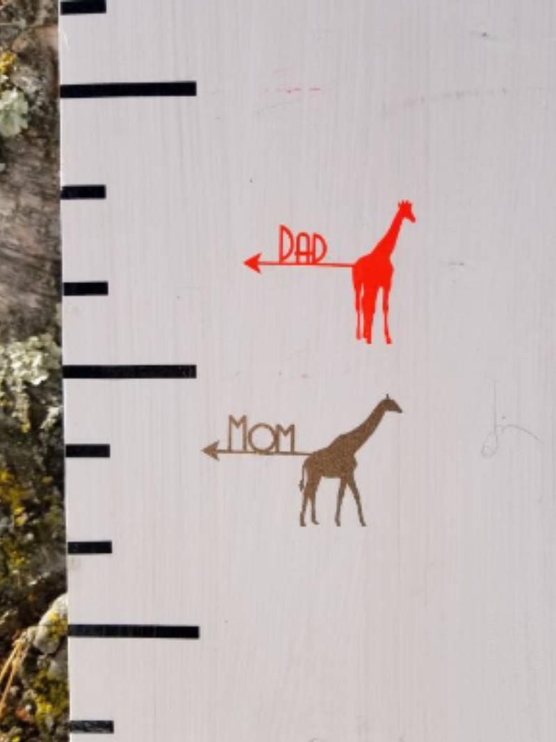 A Parent Giraffe Height Markers and a Parent Giraffe Height Markers standing next to a ruler, brought to you by Little Prairie Craft Co.