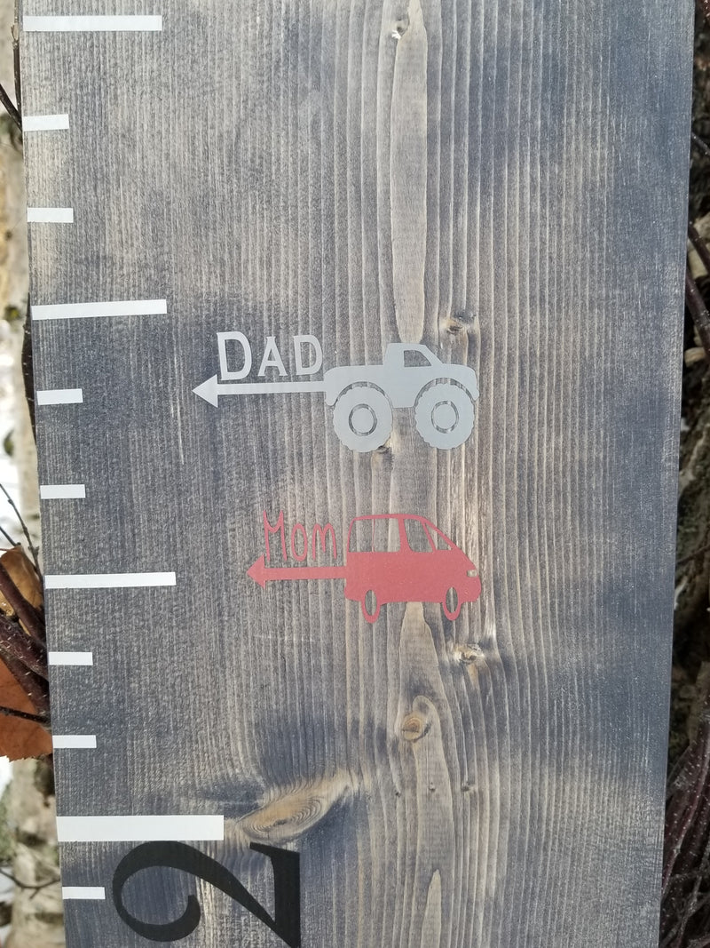 A wooden Truck Parent Height Markers growth chart with the words dad and truck by Little Prairie Craft Co.