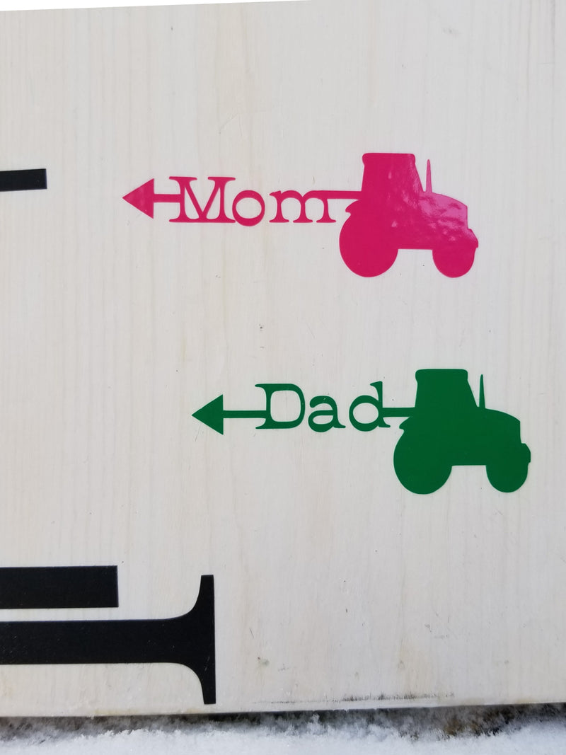 A wooden sign with the words Tractor Parent Height Markers by Little Prairie Craft Co. on it.