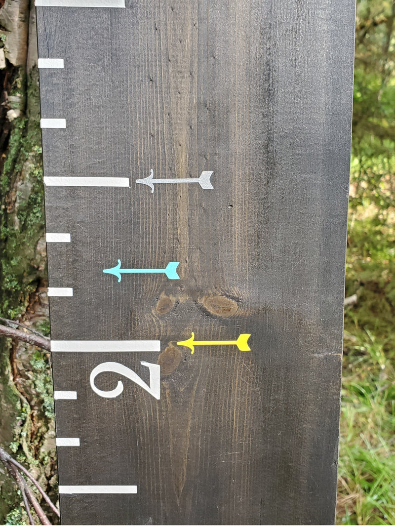 A Lil Mini Fancy Height Marking Arrows growth chart with arrows on it.